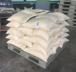After milling rice is bagged up, stacked and is ready for resting.
