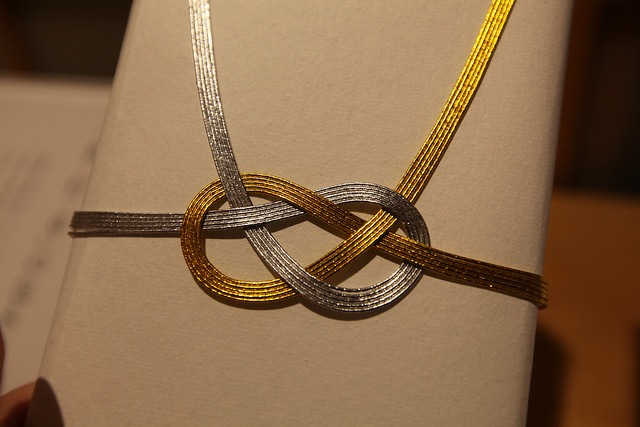 Awajimusubi.  Pulling on this knot brings the circles closer together symbolizing close relationships.